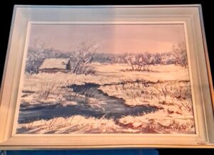 Duży obraz olejny w ramie przedstawiający malowniczy pejzaż zimowy