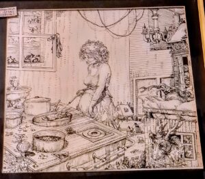 Oryginalny rysunek satyryczny Janusza Wiśniewskiego z 1975 roku oprawiony w drewnianą ramę, widok frontowy.