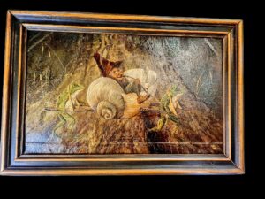 Obraz olejny na tekturze przedstawiający bajkową scenę: krasnal w lektyce niesionej przez dwie żaby.