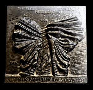Plakieta pamiątkowa z wizerunkiem pomnika Powstańców Śląskich i napisem Warszawa powstańcom śląskim